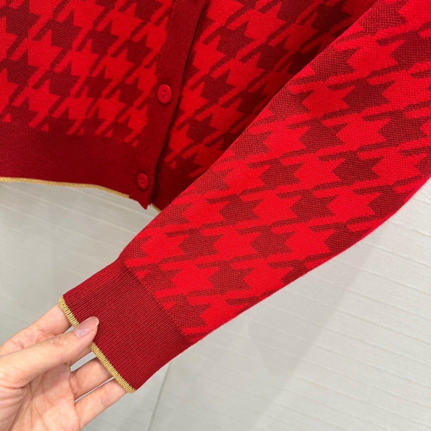Gold-trimmed houndstooth knitted cardigan